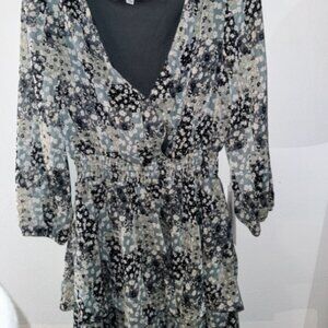 never worn. still has tags. has a little button to show less chest if wanted